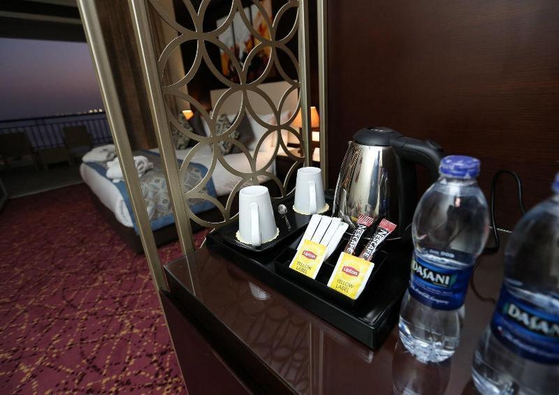 Tolip El Forsan Hotel Исмаилия Экстерьер фото Bottled water in a hotel room