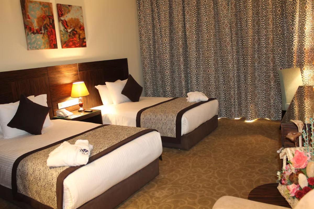 Tolip El Forsan Hotel Исмаилия Экстерьер фото A room at the hotel